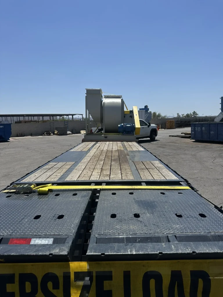 Long flatbed trailer view showing open deck and loading configuration